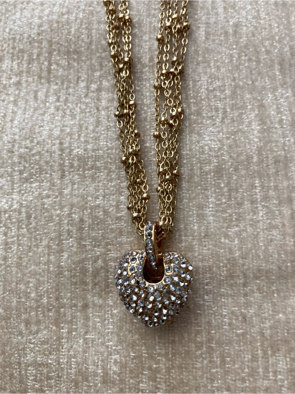 Five-Strand Crystal Heart Pendant Necklace Scroll Detail by Avenue Goldtone